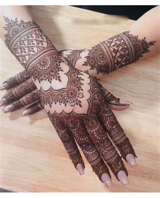 Ethnic Leaf Wrap On Back Hand Mehndi Design